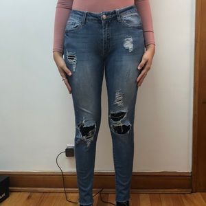 Ripped light wash skinny jeans